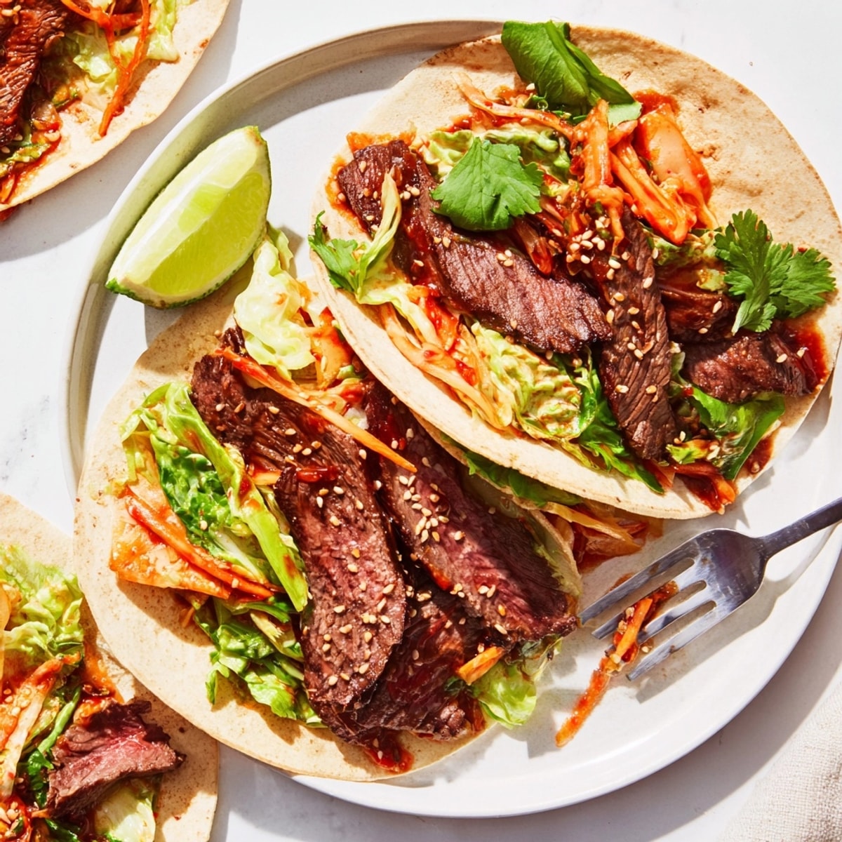 Golden-brown Korean BBQ Beef Tacos, vibrant kimchi, crisp veggies—a fusion of taste and texture.