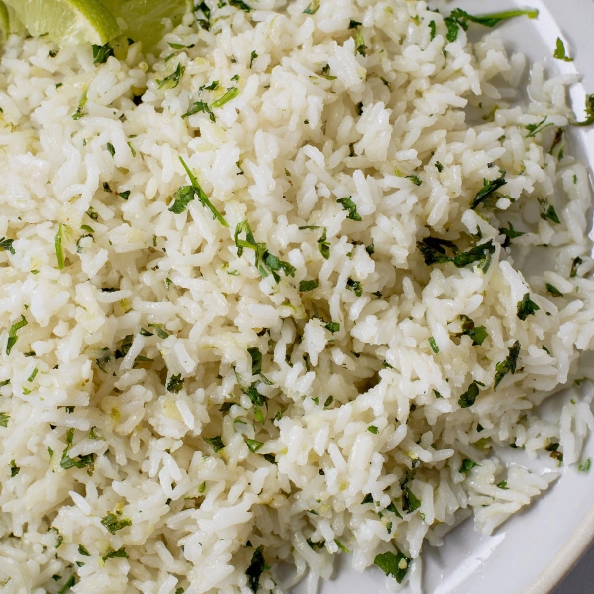 Fluffy Cilantro Lime Rice: Zesty, vibrant green flecks amidst perfectly cooked grains.