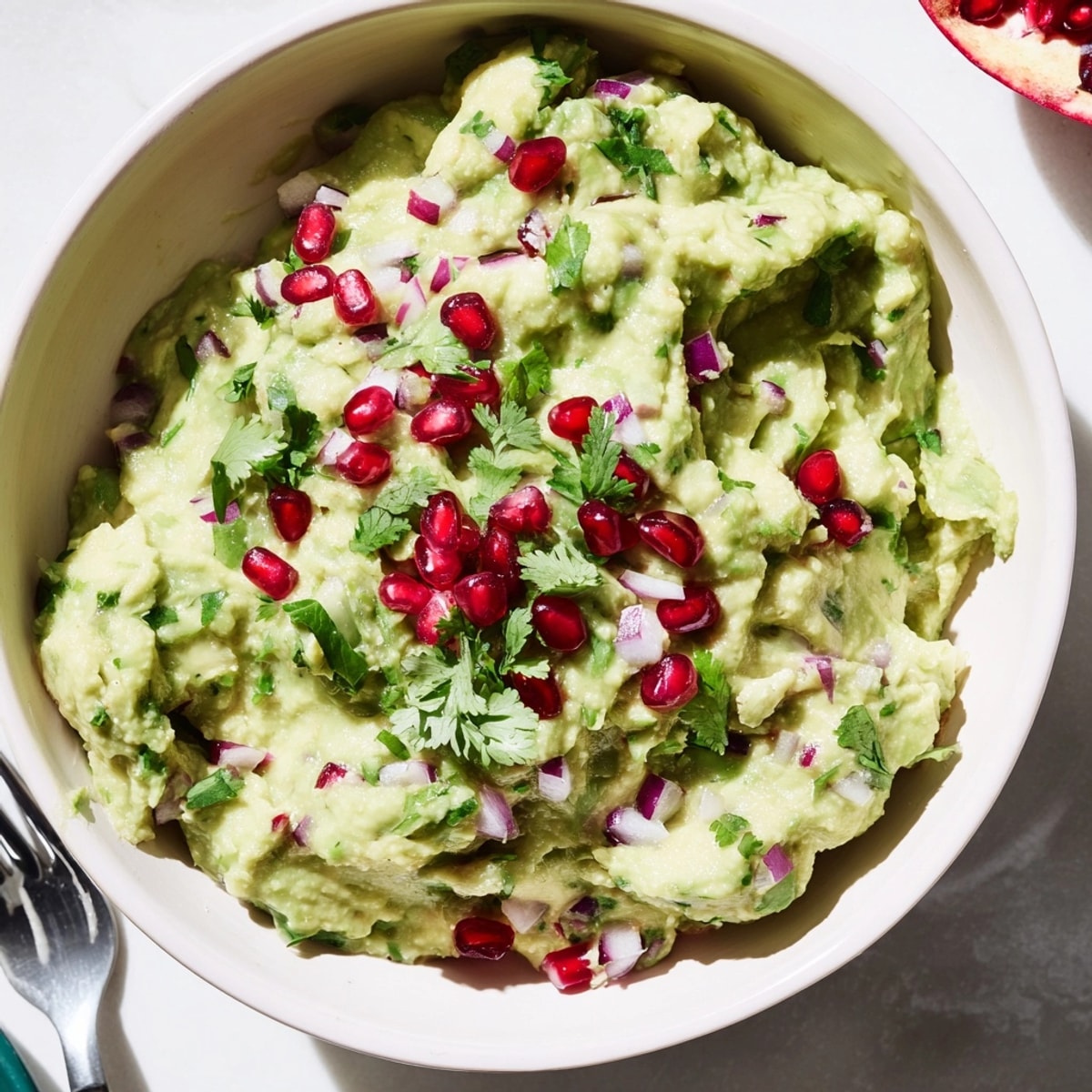 Fresh Pomegranate Guacamole recipe, a colorful appetizer bursting with sweet and savory flavors.