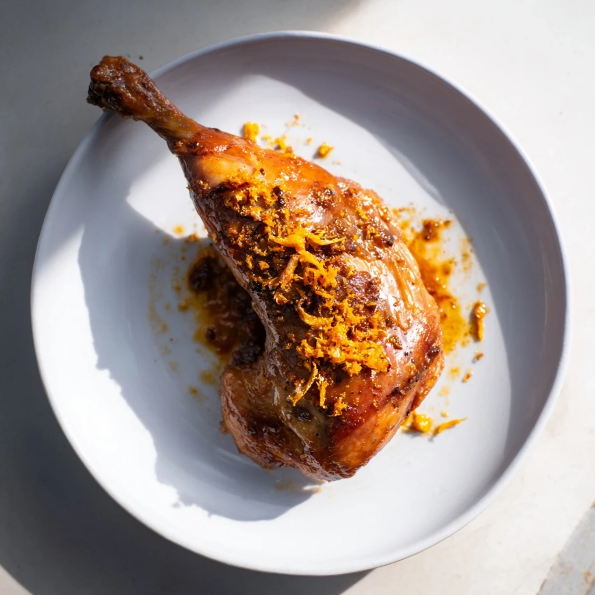 Juicy roasted duck, glazed in sweet orange and zesty ginger, ready for serving during a feast.