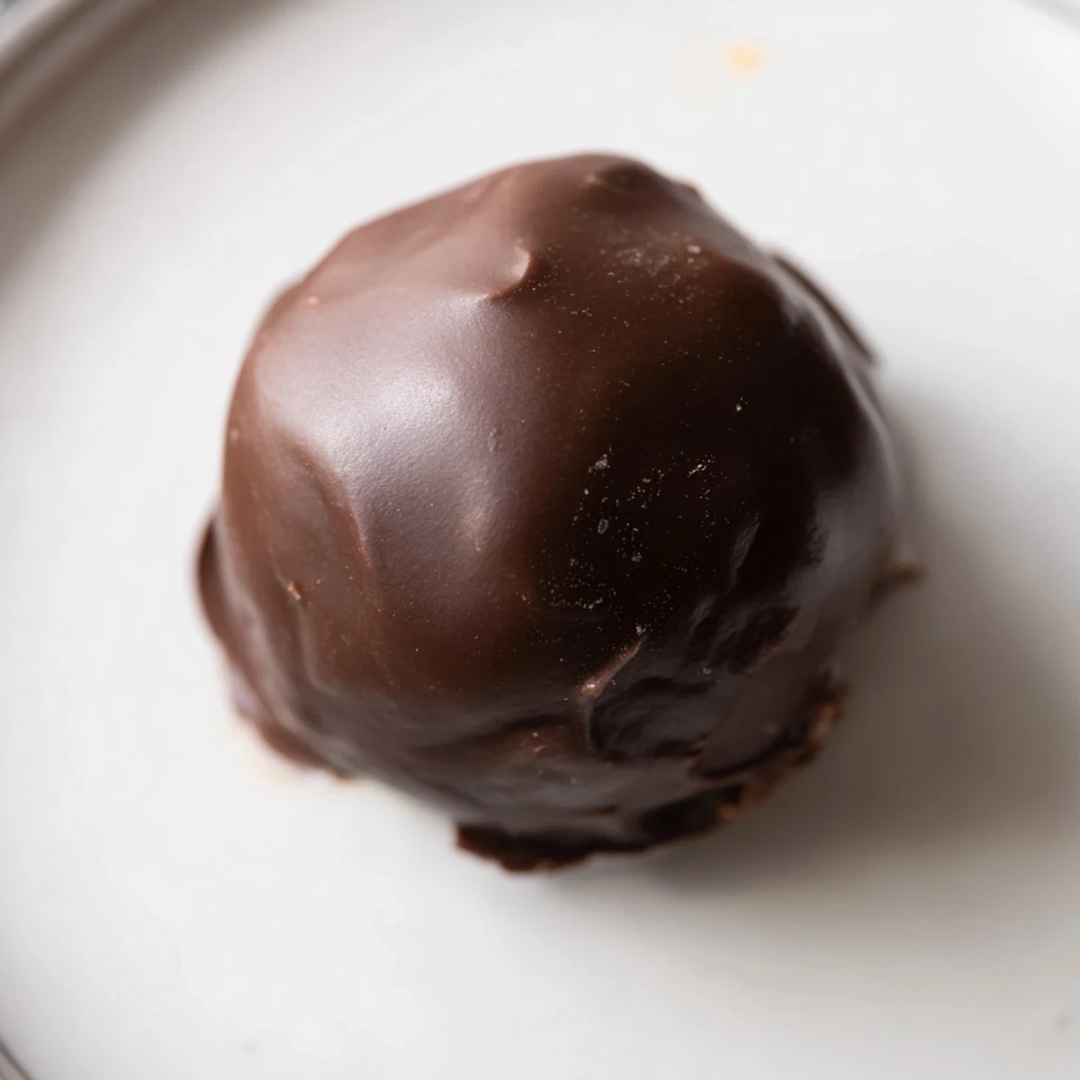 Chocolate-covered peanut butter balls, a classic no-bake dessert, ready for serving or snacking.