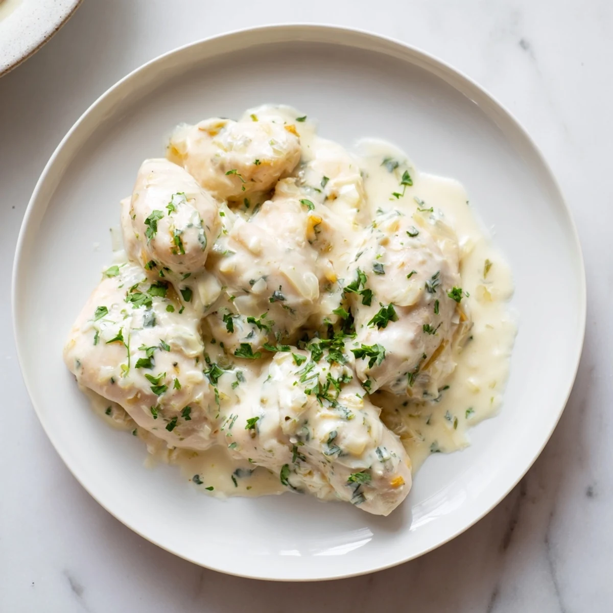 Steaming Creamy Boursin Chicken in a skillet, showing the rich garlic cheese sauce coating tender chicken.