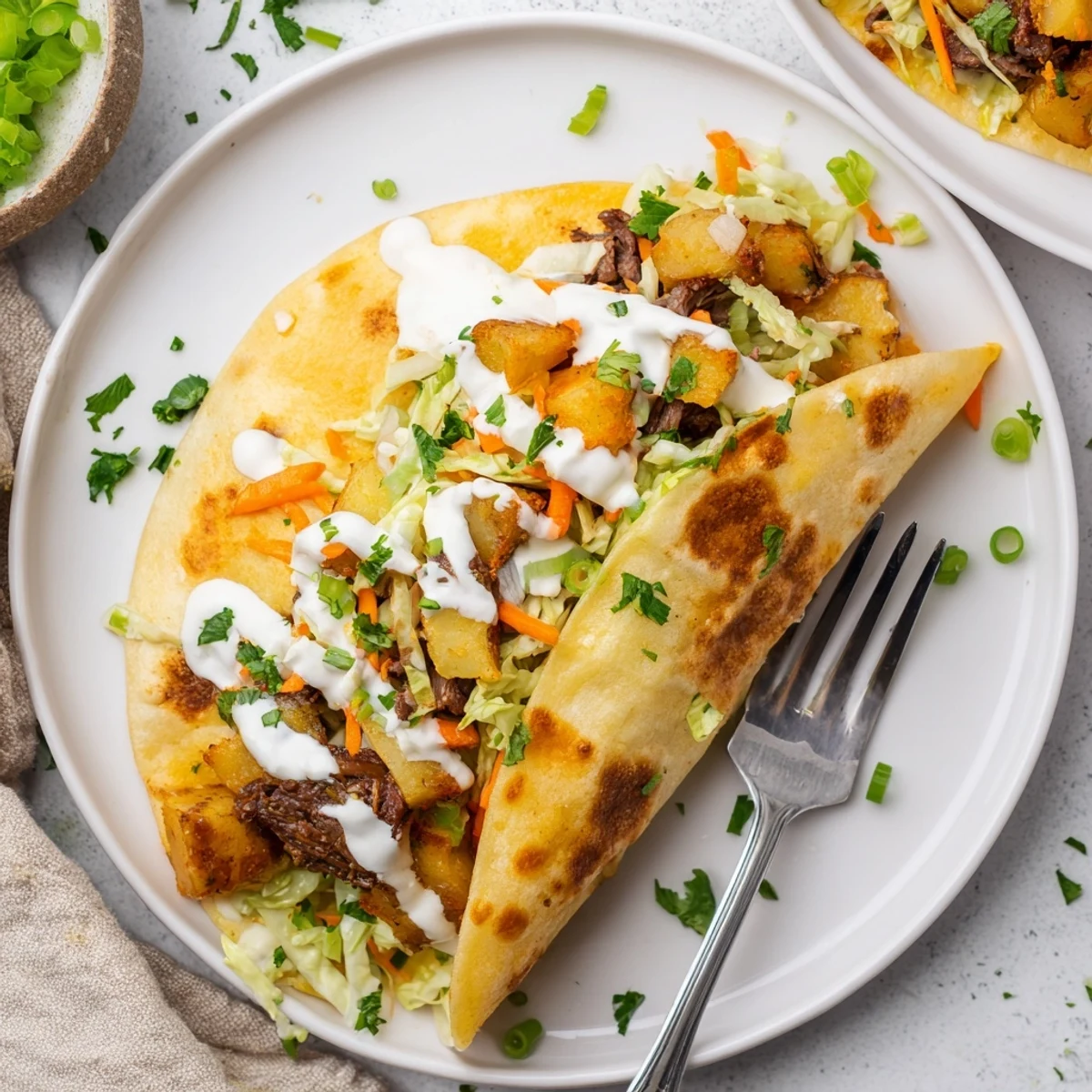 Warm flour tortillas filled with Irish corned beef, crispy potatoes, and fresh cabbage slaw