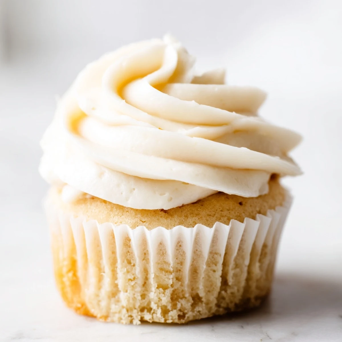 Classic American vanilla cupcakes with smooth buttercream frosting, perfect for birthday parties and celebrations