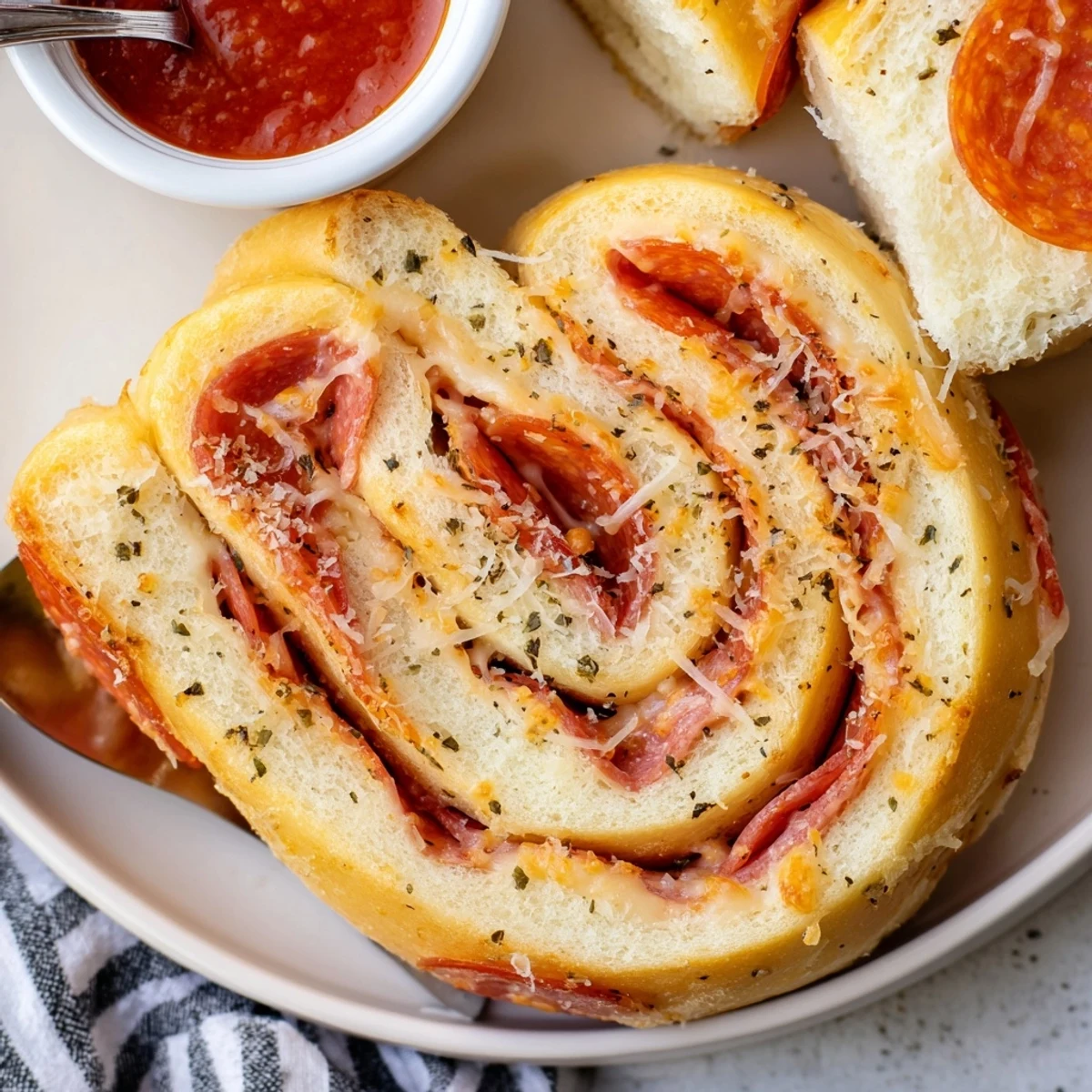 Pepperoni Pizza Roll Breadsticks Recipe with golden crust, melted mozzarella, marinara for dipping