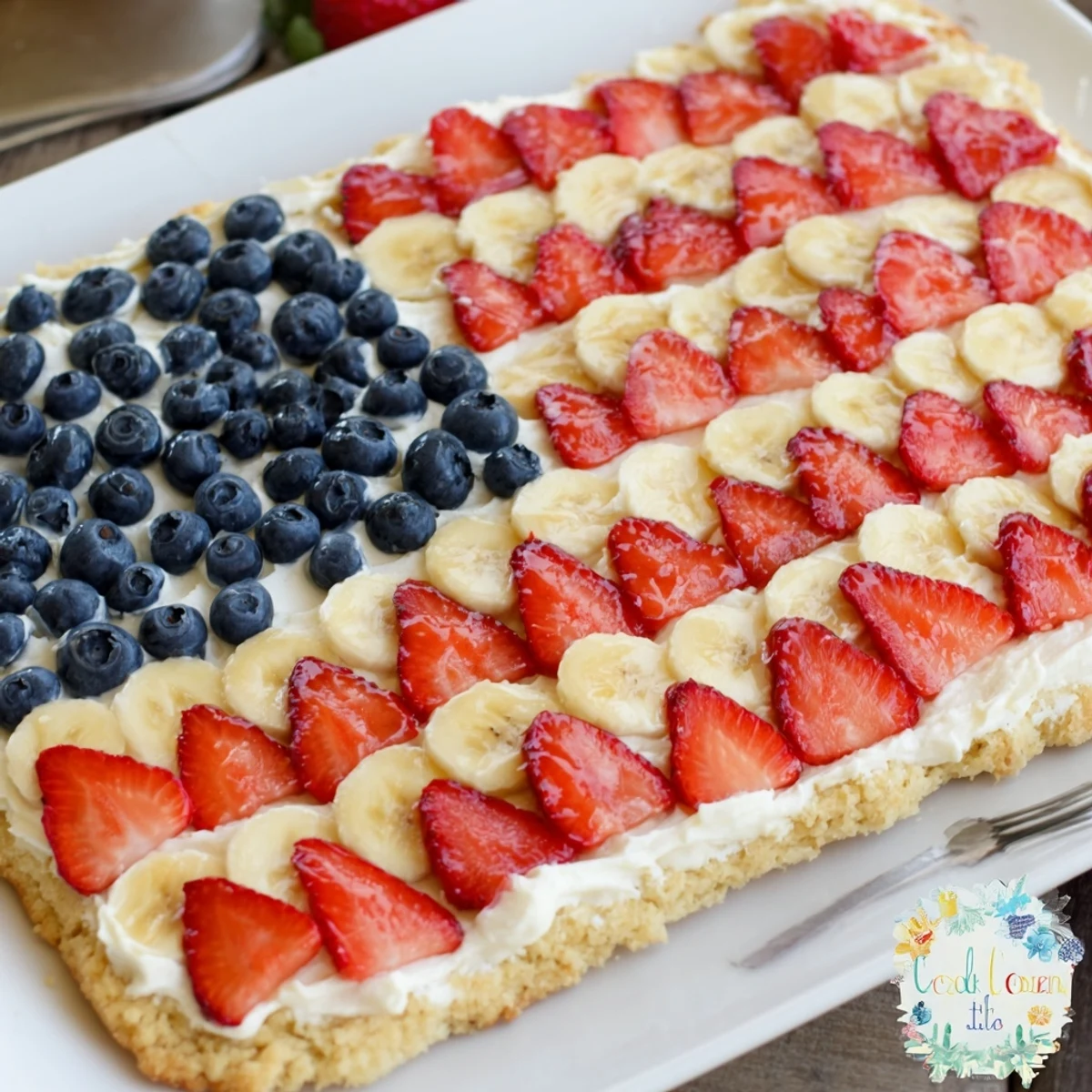 American Flag Fruit Pizza on a cookie crust with glossy fresh berries