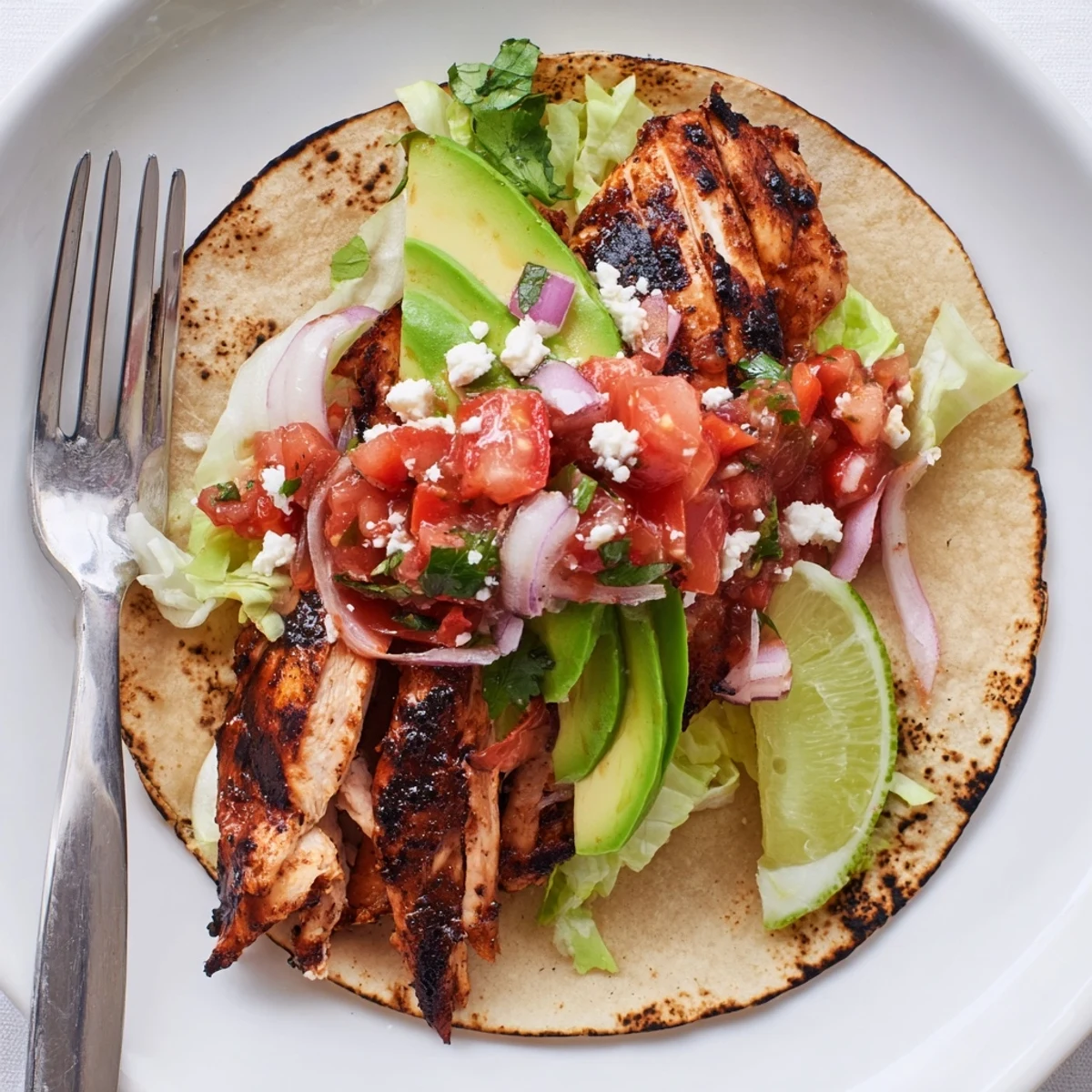 Charcoal Grilled Tacos Recipe: smoky chicken, charred tortillas, zesty lime wedges